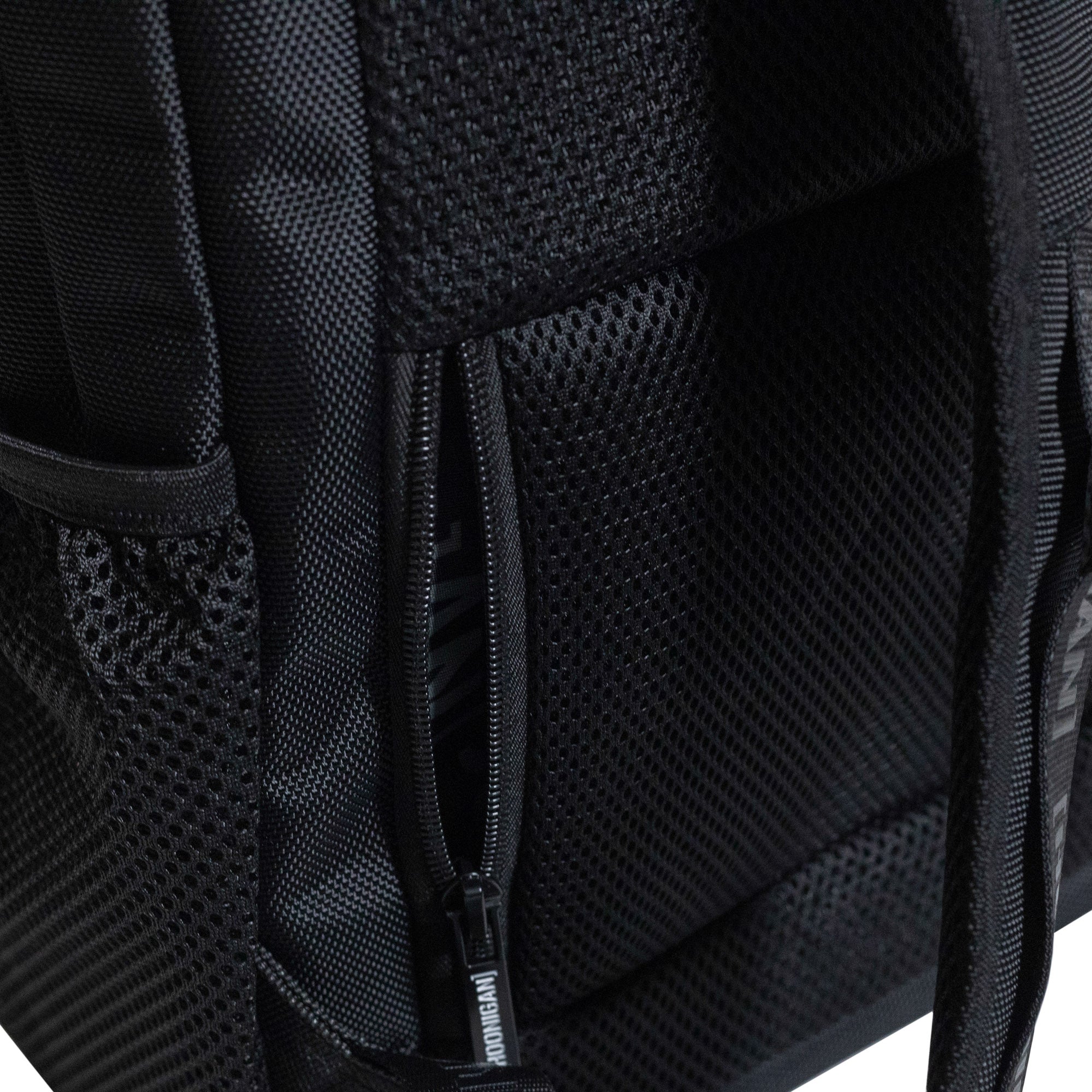 Hoonigan METAL BAR Backpack featuring a black design, adjustable straps, and a front logo patch.