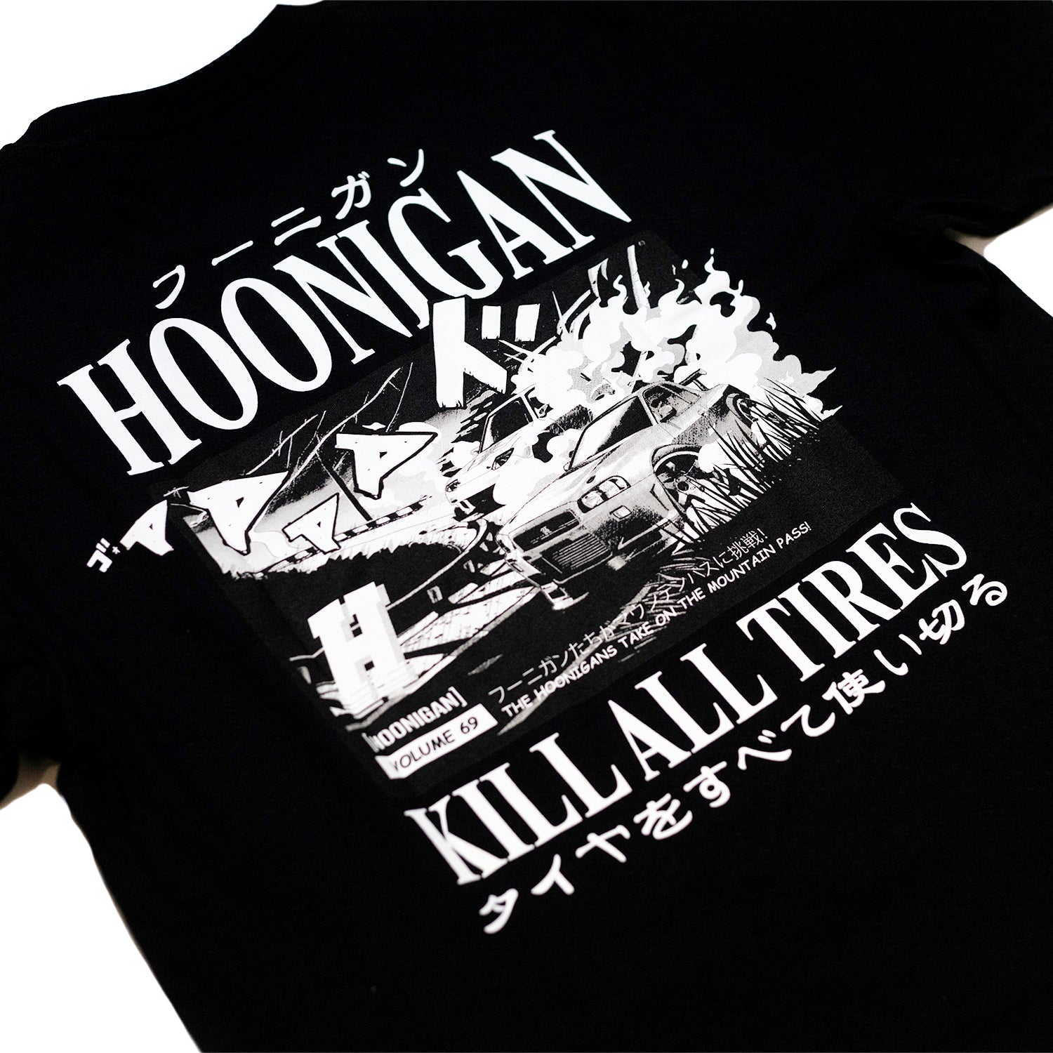 Black T-shirt featuring a graphic design with Japanese characters, racing cars, and bold text reading "Hoonigan Tokyo Drip" and "Kill All Tires.
