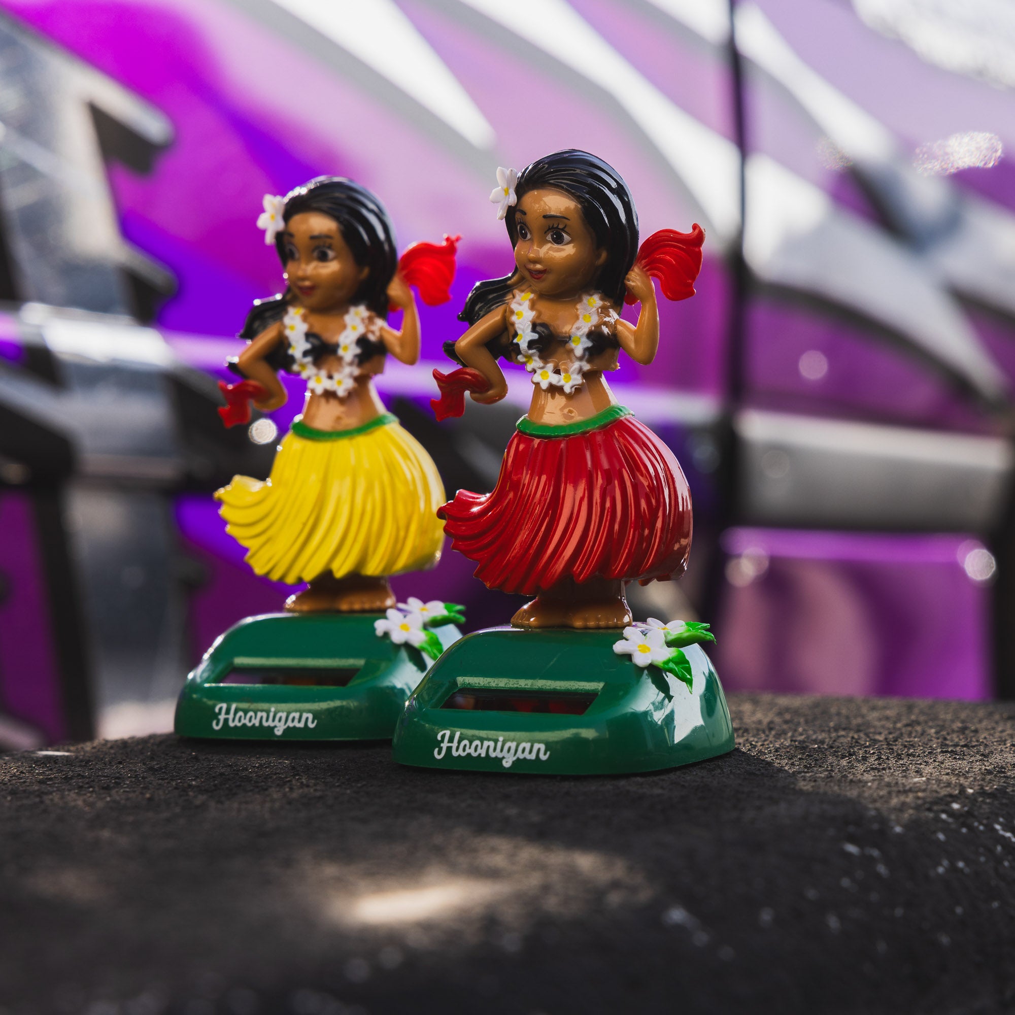 Hoonigan HULAgan GIRL graphic print featuring a vibrant design with a hula girl and Hoonigan logo.