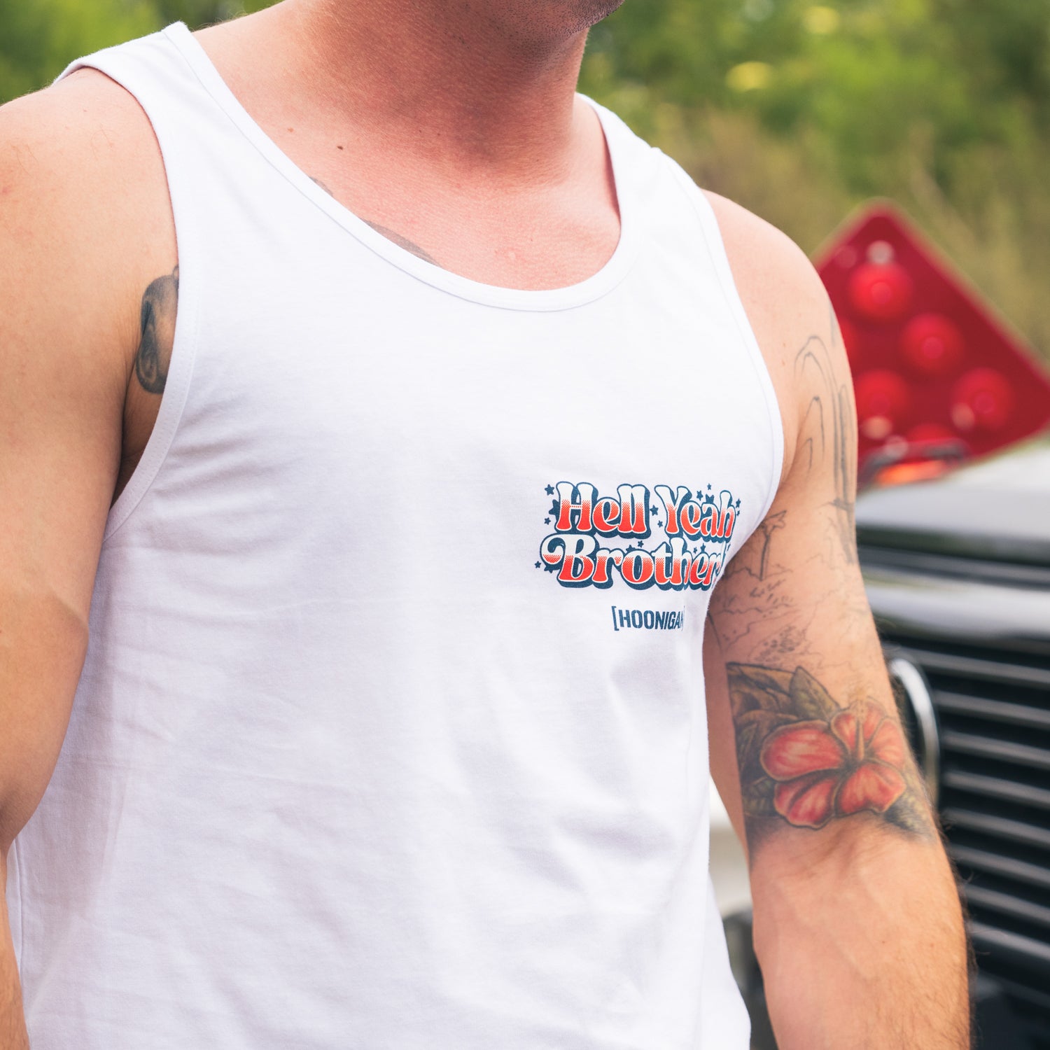 Hoonigan 'MERICA Tank Top featuring a bold graphic design with an American flag motif and the word "MERICA" in stylized lettering.