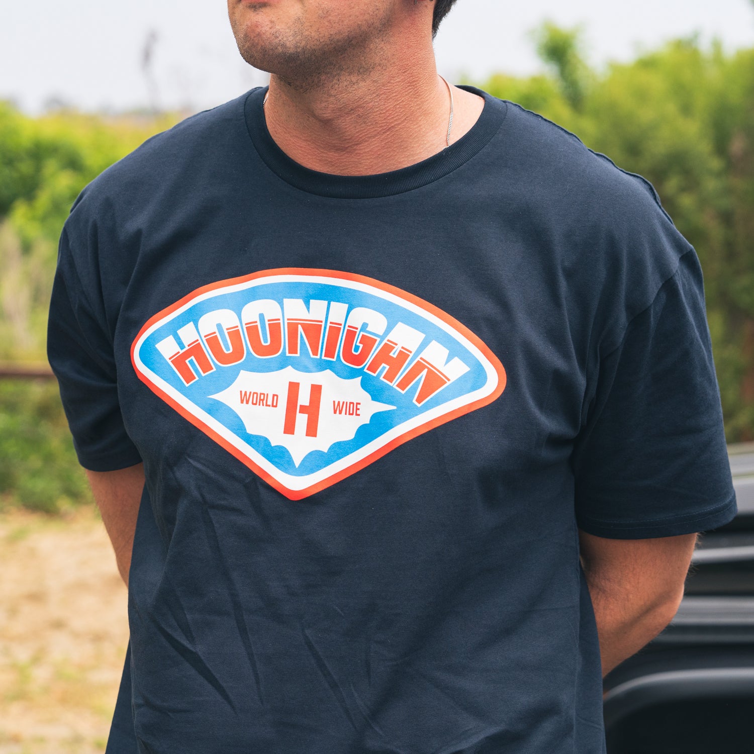 Hoonigan FULL SERVICE summer short sleeve tee in black, featuring bold white graphic logo on the front.