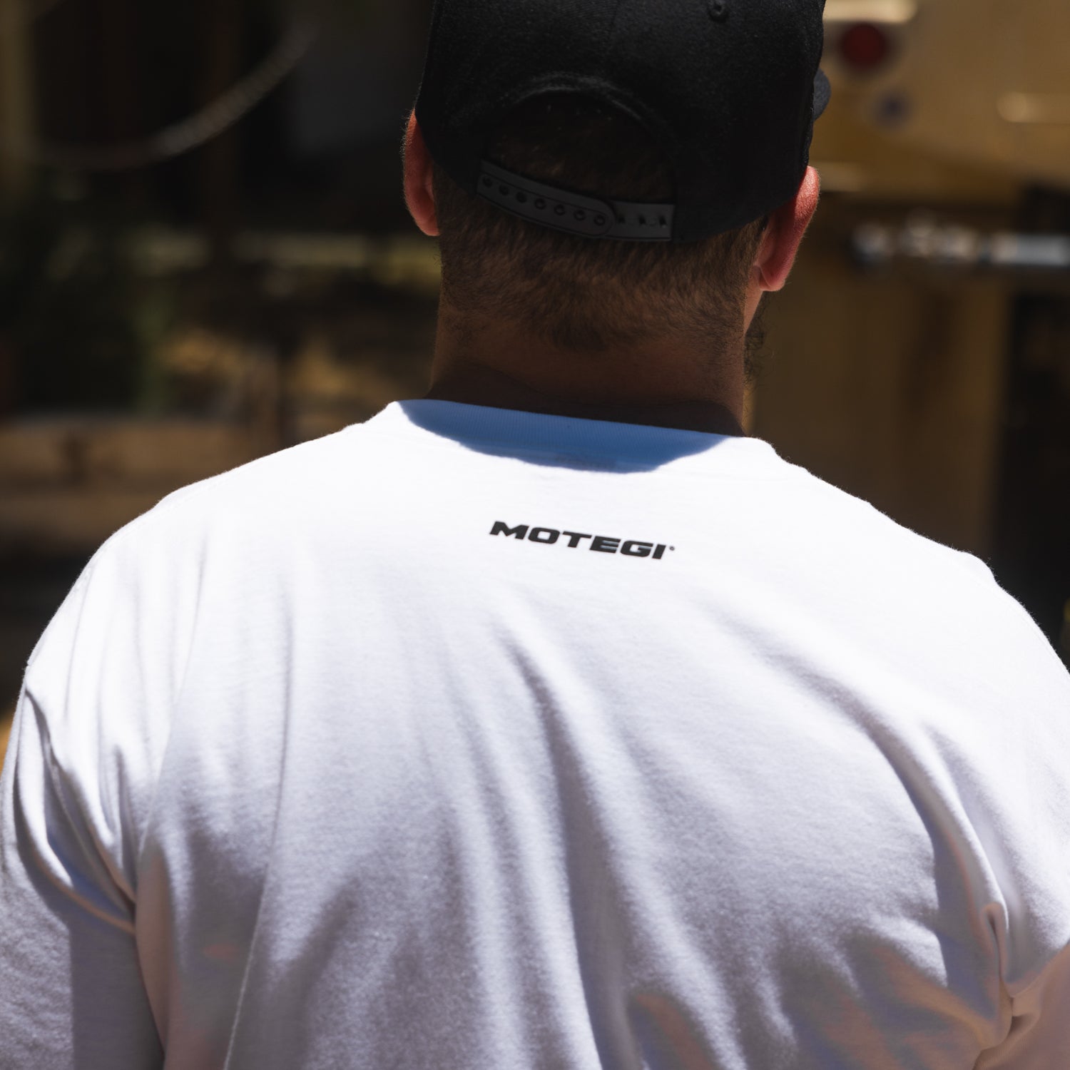 Motegi SD Series Short Sleeve Tee featuring a bold graphic design on a black background, ideal for casual wear and motorsport enthusiasts.