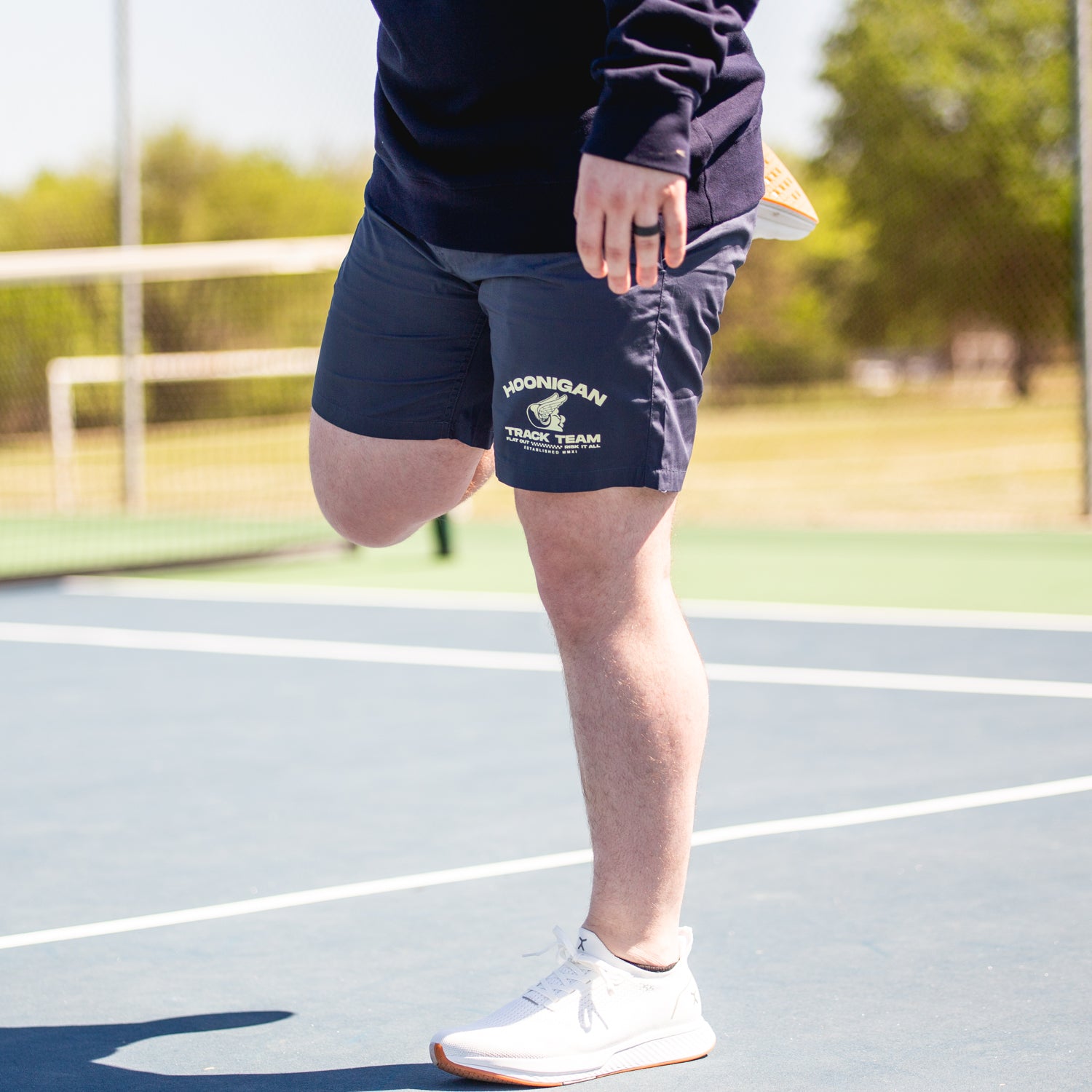Hoonigan TRACK TEAM Athletic Shorts in black, featuring a logo on the left thigh and an elastic waistband.