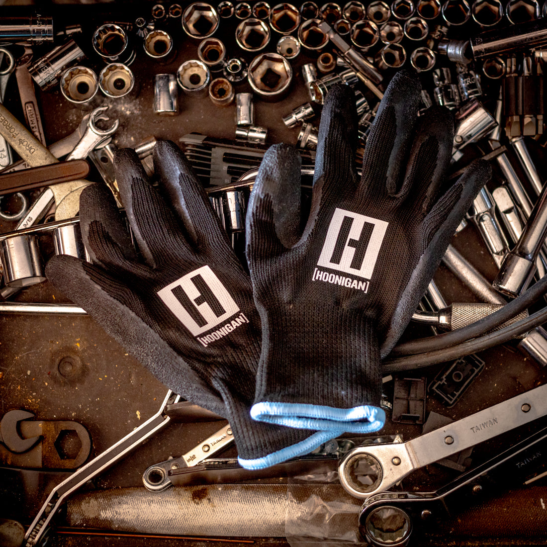 Hoonigan HBOX work gloves featuring black and orange design, reinforced palm, and breathable fabric for durability and comfort.