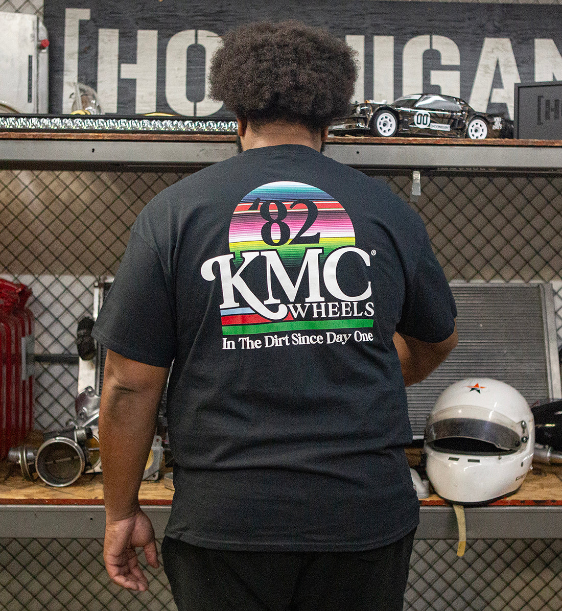 KMC DAY ONE Short Sleeve Tee displayed from the back, featuring a stylish black design suitable for casual wear.