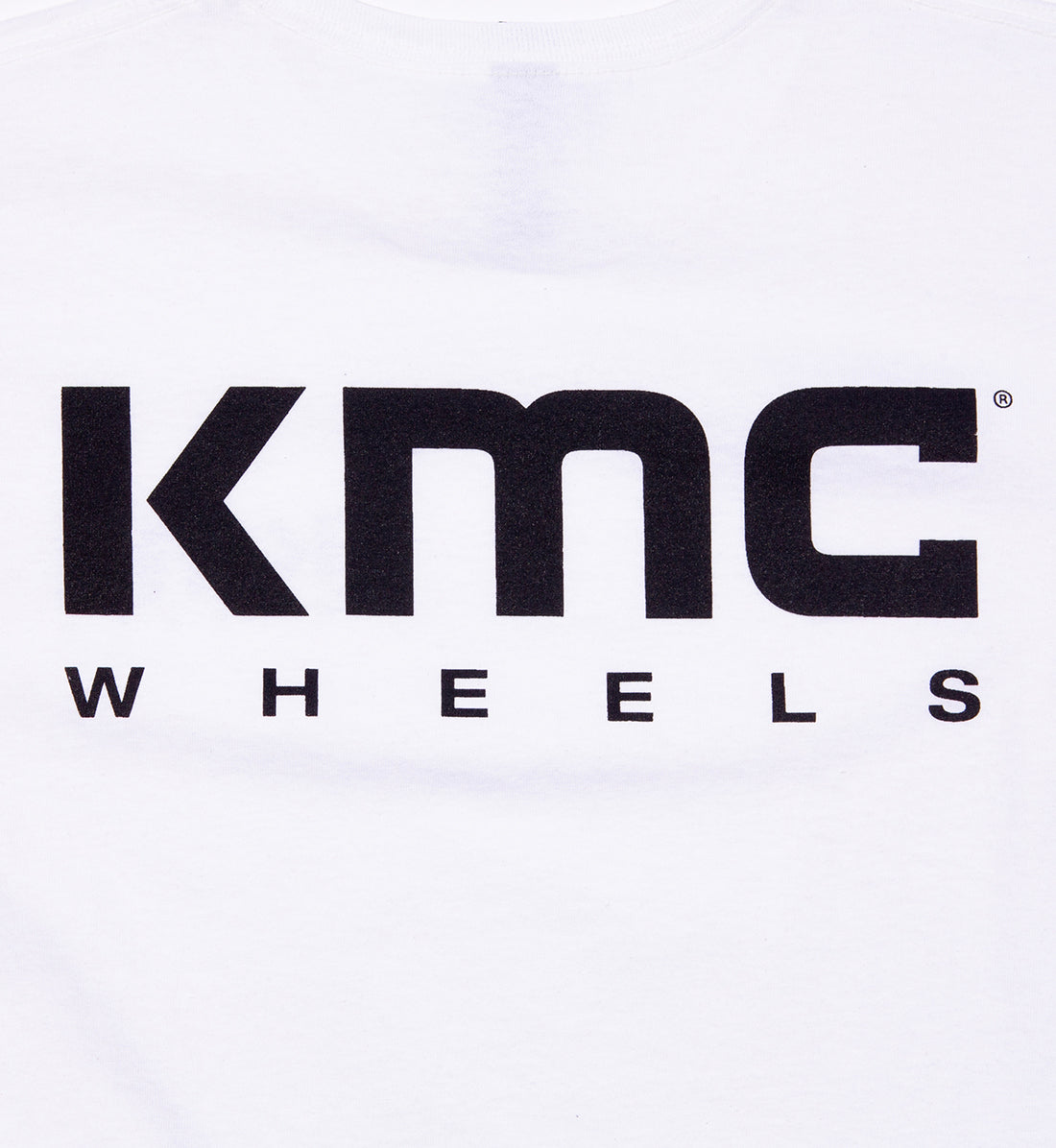 KMC women's short sleeve tee featuring a stylish logo on a white background.