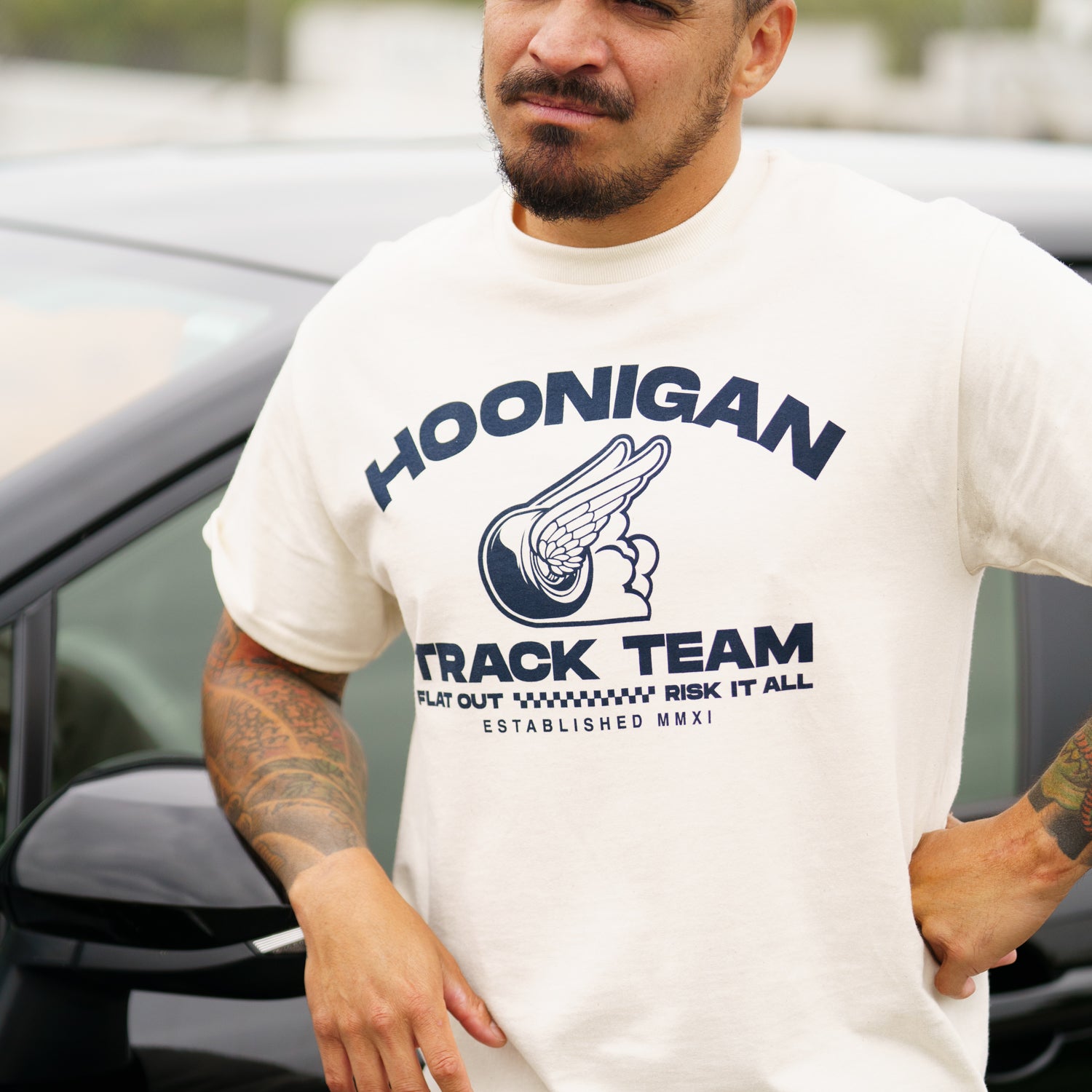 Hoonigan TRACK TEAM Short Sleeve Tee featuring a bold logo on the front against a black background.