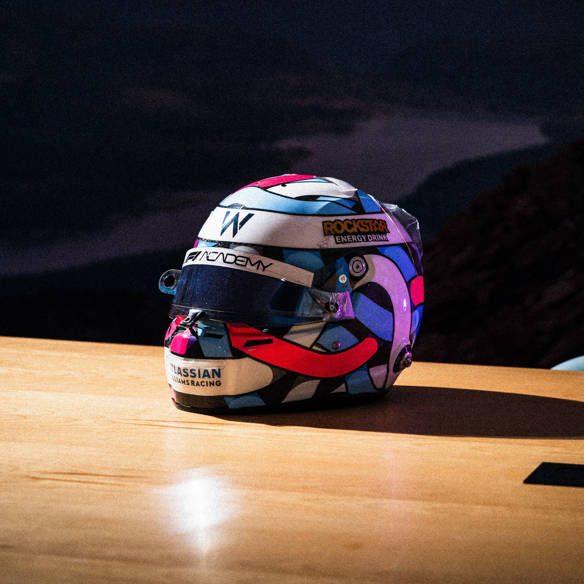 Hoonigan x Lia Block HELMET BOX sticker featuring a colorful helmet design, perfect for motorsport enthusiasts.