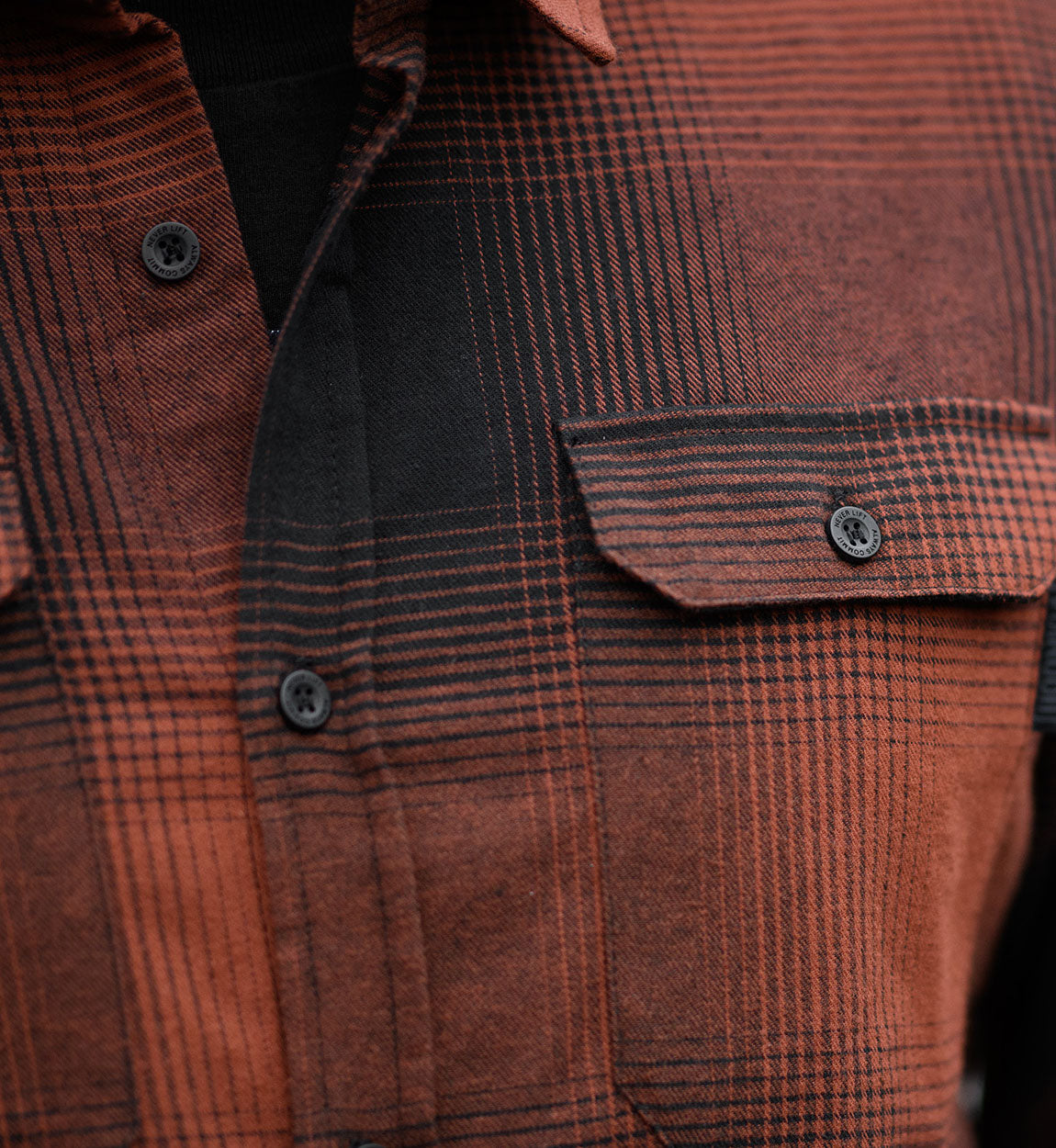 Hoonigan RUST Long Sleeve Flannel Shirt in black and orange checkered pattern.