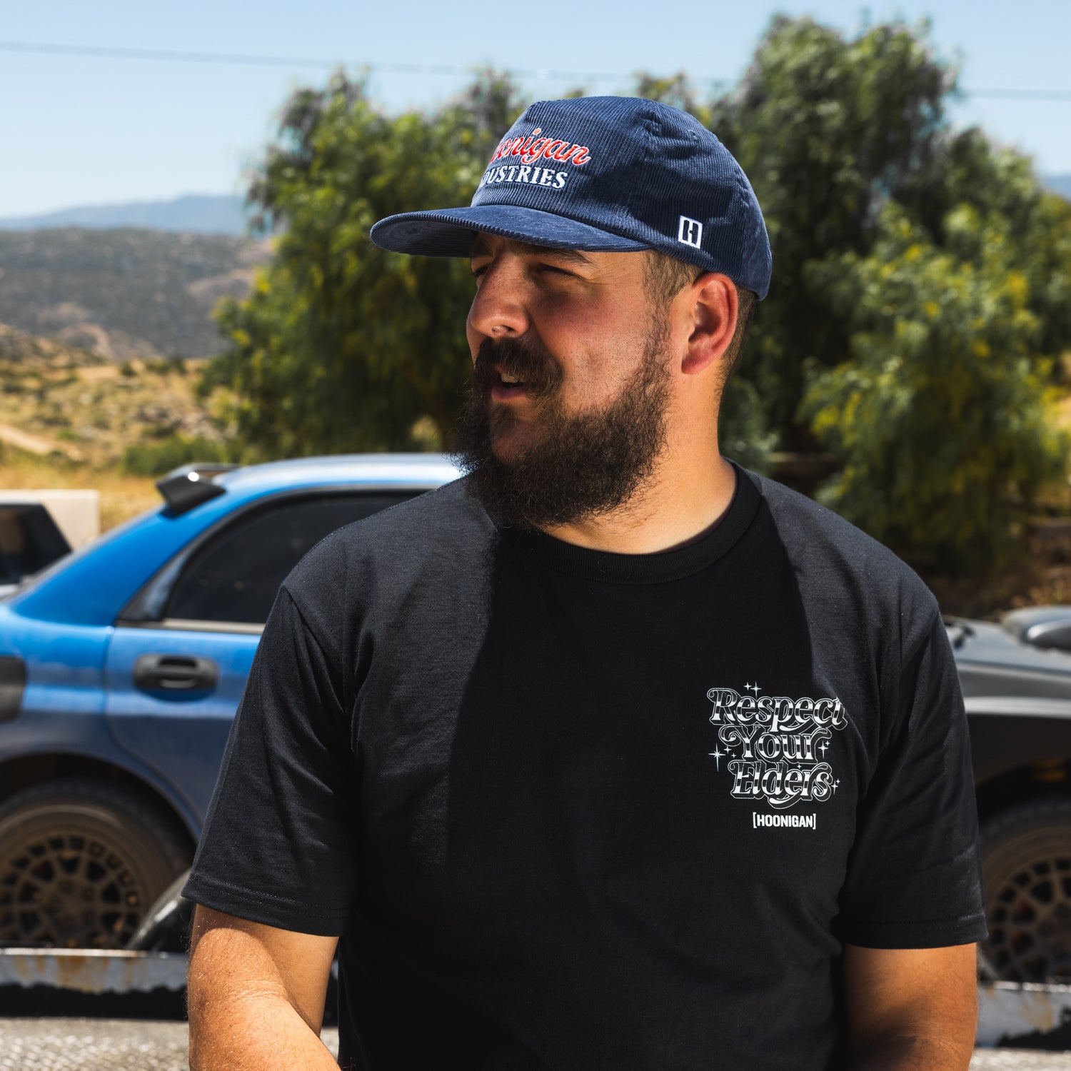 Hoonigan ROCKIES unstructured snapback hat with adjustable strap, featuring an embroidered logo on the front and a black color.